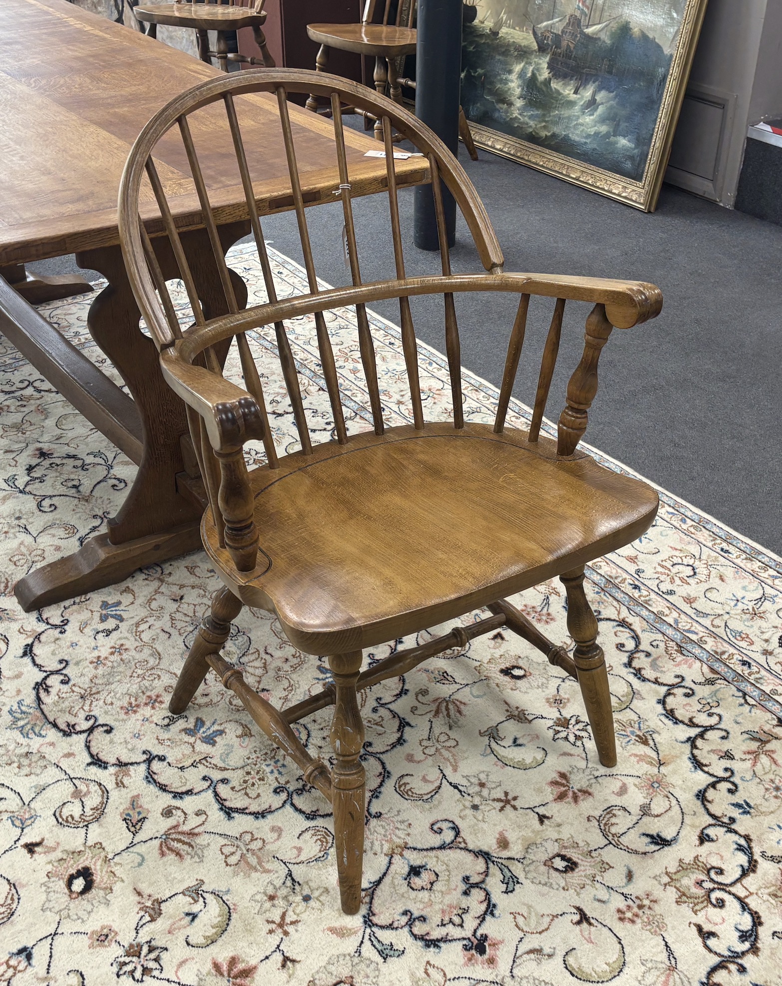 A set of six reproduction Windsor beech comb back dining chairs, two with arms